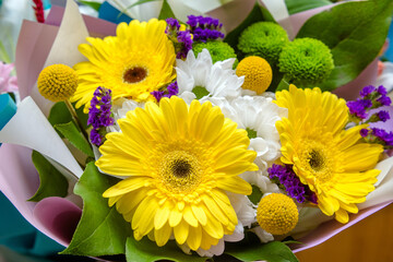 A festive bouquet of yellow gerberas taken in close-up
