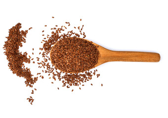 Flax seeds in a wooden spoon isolated on white background.