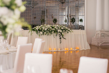 Main table at a wedding reception with beautiful fresh flowers