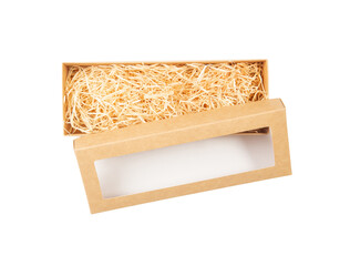 Top view of open cardboard box with shredded wood excelsior for filling inside window. Using...