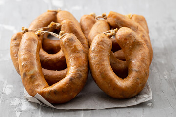typical portuguese smoked sausage alheira on dark dish