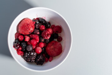 Fruit bowl with currants, blueberries, strawberries, blackberries and raspberries. Healthy diet concept