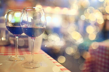 evening in a restaurant, blurred abstract background, bokeh, alcohol concept, wine glasses in a bar