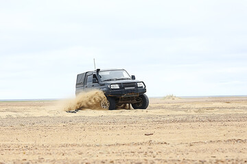 SUV in the desert / old vintage all-terrain vehicle, expedition in the desert on the sand, extreme cars