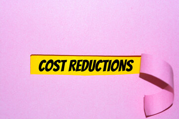 Cost Reductions words on copybook page. Production or reselling Business concept for reduction expenses for goods and services.