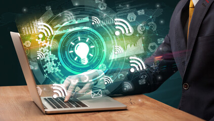 Business hand typing on a modern laptop