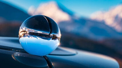 Crystal ball alpine winter landscape shot at the famous Rossfeldstrasse near Berchtesgaden, Bavaria, Germany