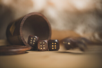 Game of wooden dice on a blurring background