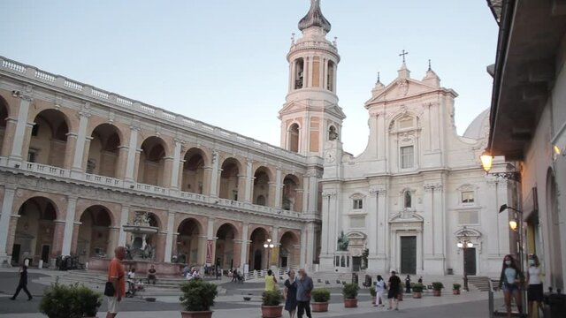 Loreto, Marche ,Italy.August 22,2020.View of the monument to Pope Sixtus the fifth, the consecration of a bronze statue from a chair and the Basilica of Santa Casa. 