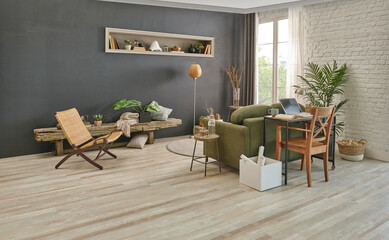 Grey stone wall in the living room, green armchair, wicker chair, orange lamp and working table, laptop and niche. Modern interior style.