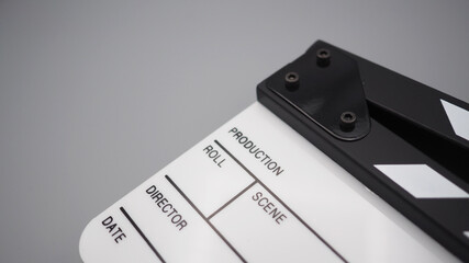 White clapperboard or movie slate use in video production ,film, cinema industry on grey background.