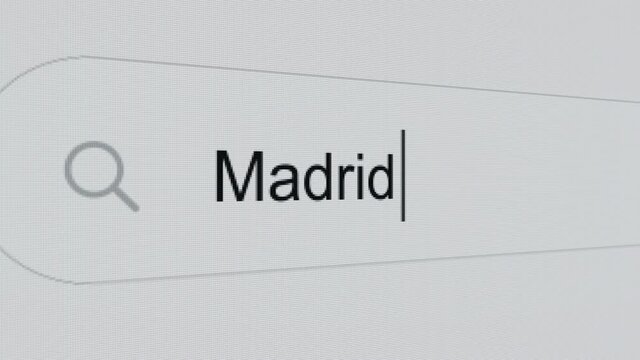 Madrid - Internet browser search engine bar typing spanish capital city name.