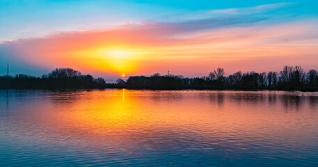 Beautiful sunset with reflections near Plattling, Isar, Bavaria, Germany