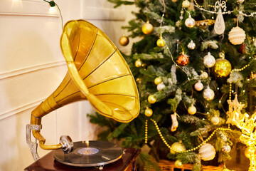 Christmas tree in the room with gramophone in New year