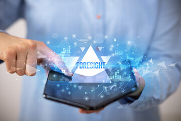 Businessman holding a foldable smartphone, business concept