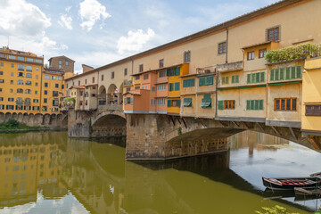 Fototapeta na wymiar Famous Florence Ponte Vecchio Bridge over River Arno in Summer, Italy
