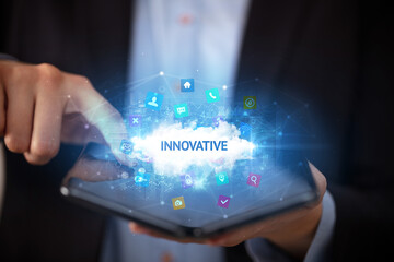 Businessman holding a foldable smartphone, technology concept