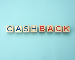 wooden cubes with the inscription cashback on a blue background. Refunds of bonuses or funds in the areas of e-commerce, banking and gambling