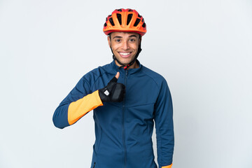 Young cyclist Brazilian man isolated on white background giving a thumbs up gesture
