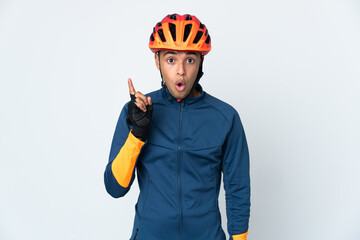 Young cyclist Brazilian man isolated on white background intending to realizes the solution while lifting a finger up
