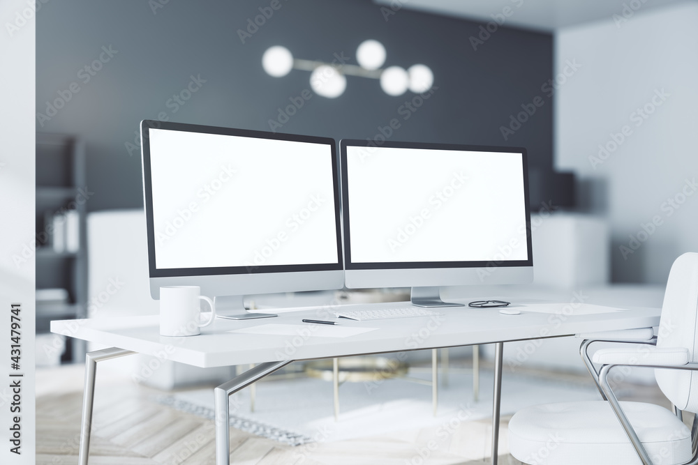 Poster white computer monitors with copyspace for your logo on work light wooden table in sunny modern inte