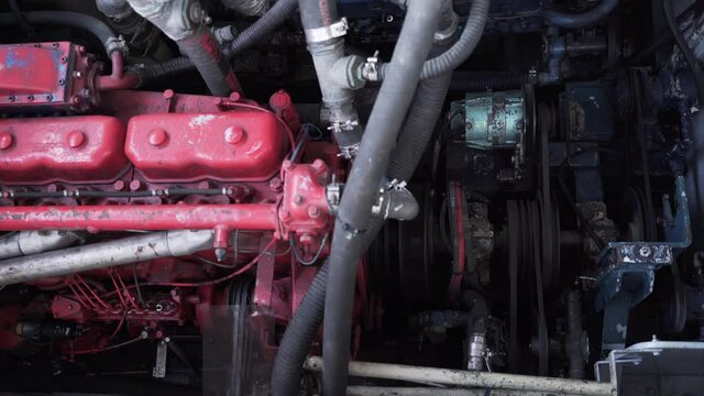 Selective focus on the operation of the timing belts of a ship's engine.