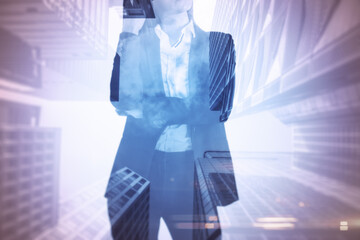 Businesswoman standing thinking with skyscrapers in the background, decision and entrepreneurship concept. Double exposure