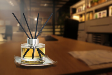 luxury aroma scented reed diffuser crystal bottle is used as room freshener and decoration items on working table in the nice dark working office to creat relax ambient during working