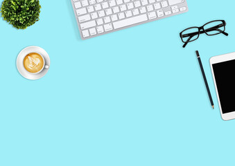 Modern workspace with coffee cup, smartphone, paper, notebook, tablet and laptop copy space on white color background. Top view. Flat lay style