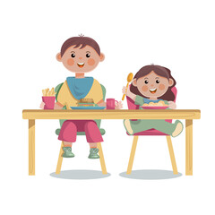 Cute little boy and girl eating at the table.