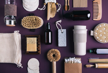 Set of natural skin care products, eco friendly bathroom and kitchen accessories on a purple background.