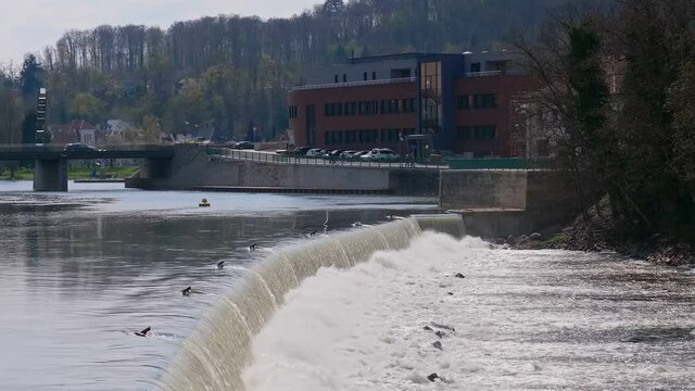 A beautiful shot of flowing water of Weser River in Hameln, Germany in HD