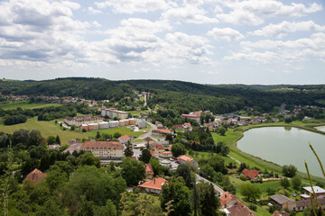 Fototapeta na wymiar Güssing, Southern Burgenland, Austria. View from observation point in castle Güssing on a village and lake in a summer day.