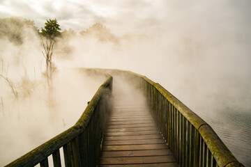 wooden bridge in fog