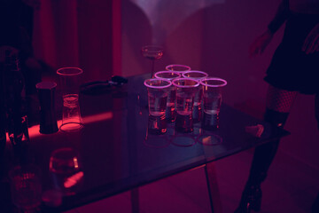 neon glowing cups at a party 