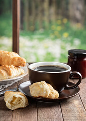 Cup of Coffee and Croissants