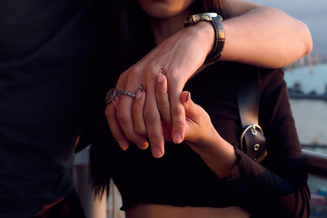 close up of couple holding hands