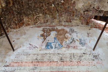 remains of drawings on the walls of a destroyed Orthodox church