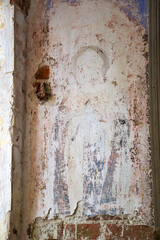 remains of drawings on the walls of a destroyed Orthodox church