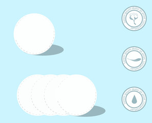 Cosmetic cotton pads isolated on blue background. Top view. © viktorijareut