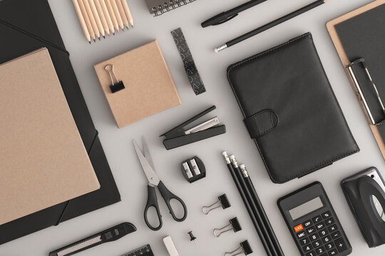 Pattern composition of office and school stationery on grey background. Back to school