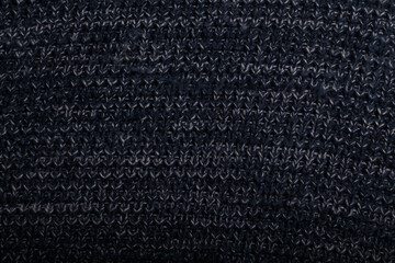 Fototapeta premium Knit dark blue fabric texture, background or backdrop. Textile, scarf or sweater textured surface. Warm accessories, clothing, fashion concept.