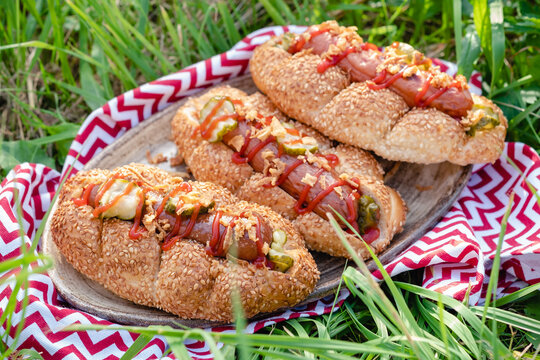 Grilled hot dogs with mustard, ketchup and relish