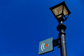 street lamp with a symbol for wireless internet