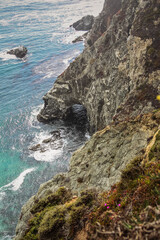 Scenic shot of the beautiful Big Sur Coast of California on a misty day, United States of America aka USA. Foamy waves in the ocean and rocky mountains