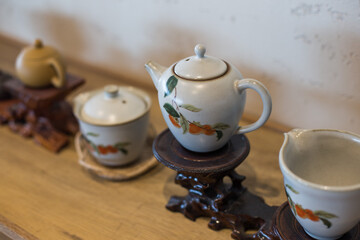 Obraz na płótnie Canvas Asian food background with a tea set, cups, and teapot.