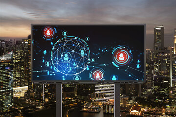 Glowing Social media icons on billboard over night panoramic city view of Singapore. The concept of networking and establishing new connections between people and businesses in Southeast Asia