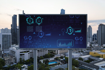 Glowing hologram of technological process on billboard, aerial panoramic cityscape of Bangkok at sunset. The largest innovative hub of tech services in Southeast Asia.