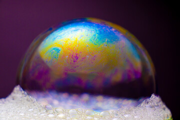 The colorful world of soap bubbles resembling space and honeycomb