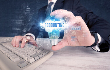 Businessman holding a light bulb, business concept